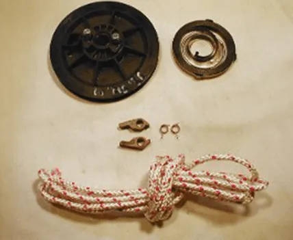 Cuyuna early-style recoil parts including black plastic recoil pulley and starter rope