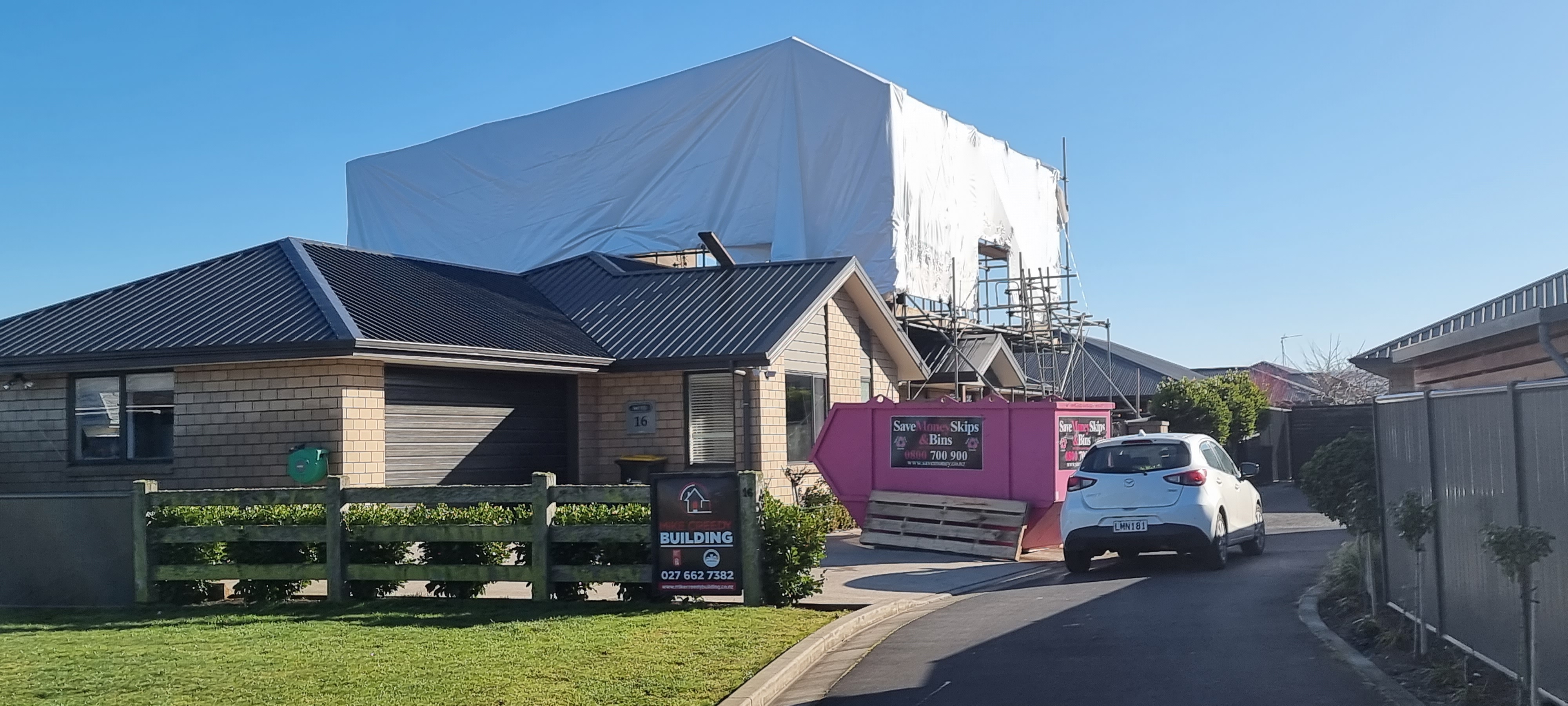 Completed silver metal roof with chimney venting installed by Manson Roofing Otago