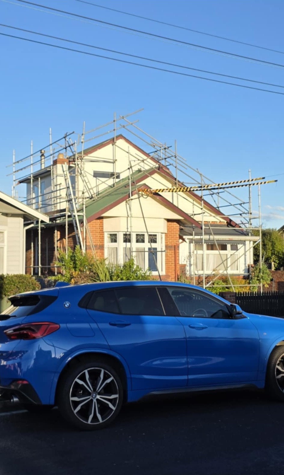 Corrugated red metal roof repair completed by Manson Roofing in Dunedin