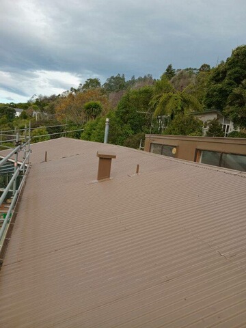 Corrugated red metal roof repair completed by Manson Roofing in Dunedin