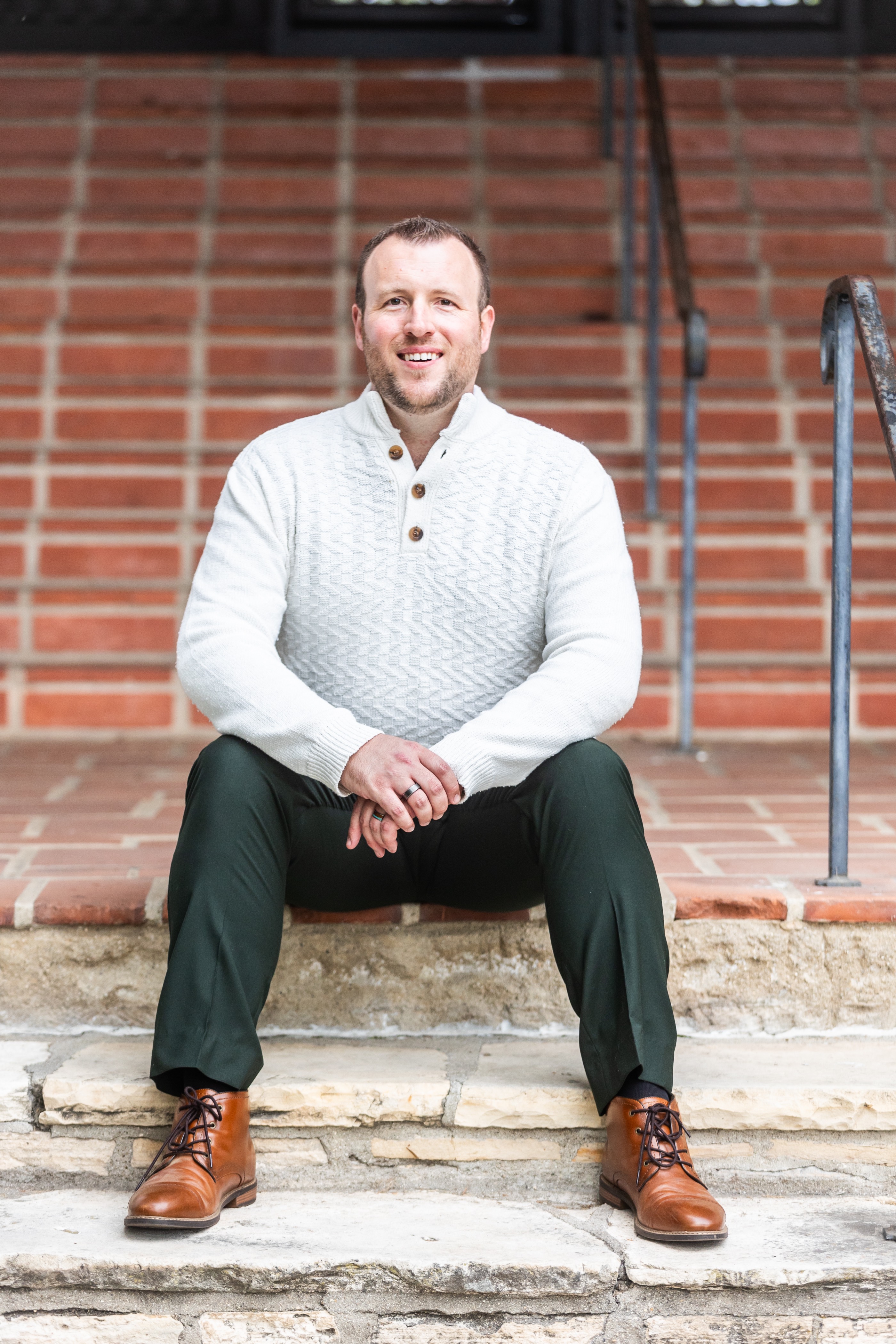 A person putting money into a calculator