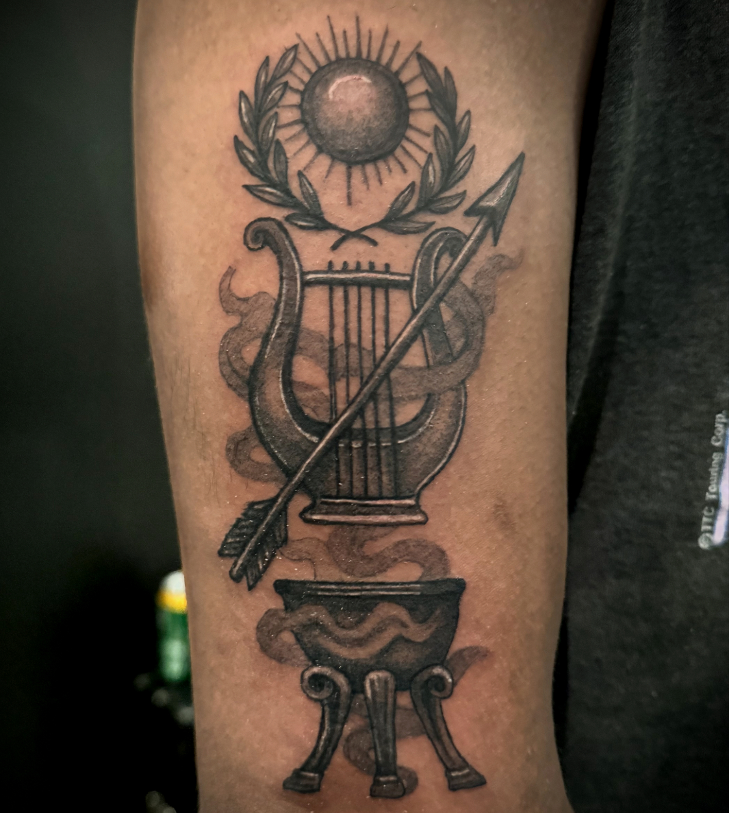 person with tattoo on right arm