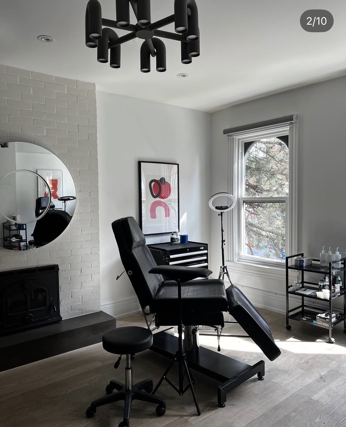 person in blue denim shorts and white nike sneakers standing on gray concrete floor