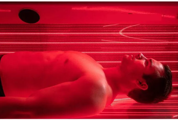 topless man in black pants