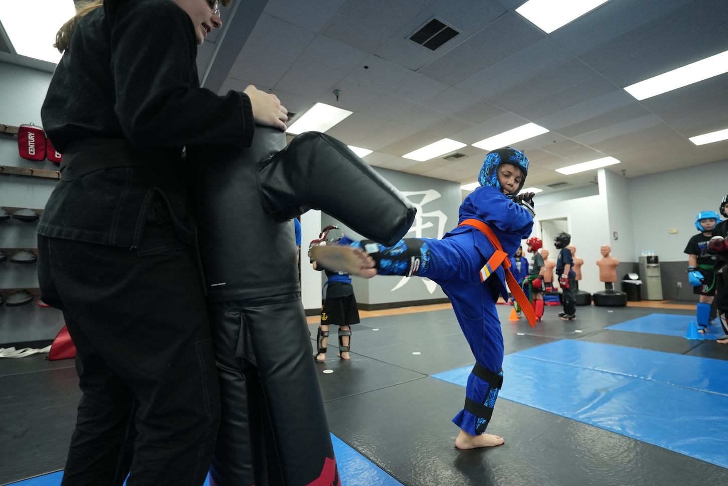 Kid throwing kick in the Best Martial Arts Studio in Town