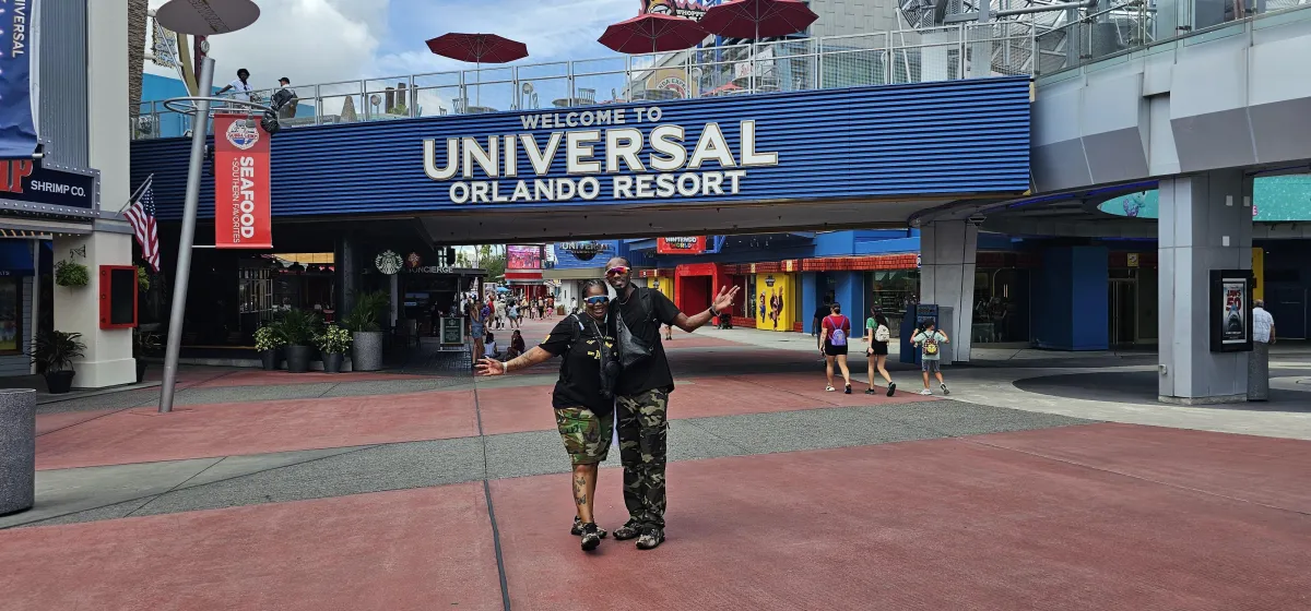 two person standing on gray tile paving