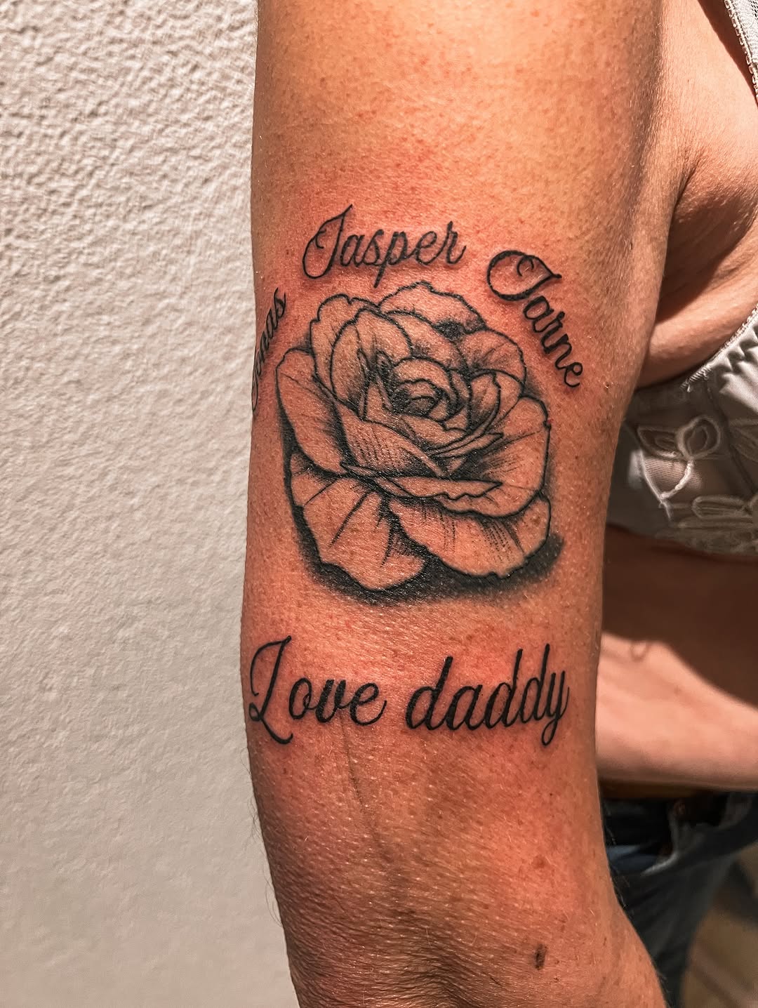 person with tattoo on right arm