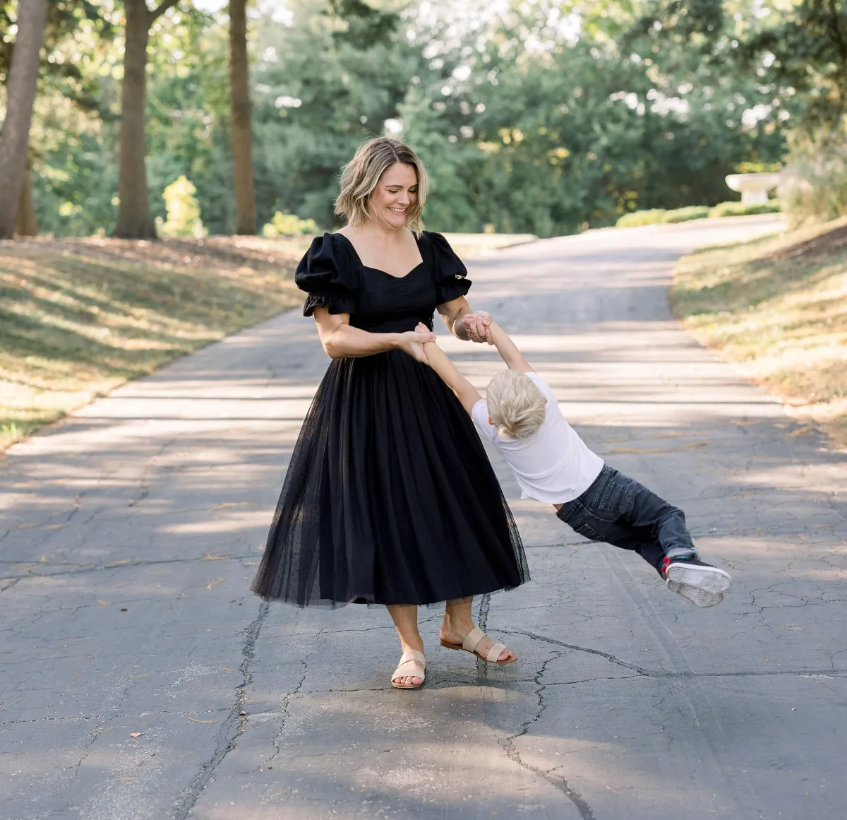 confident mom holding happy child