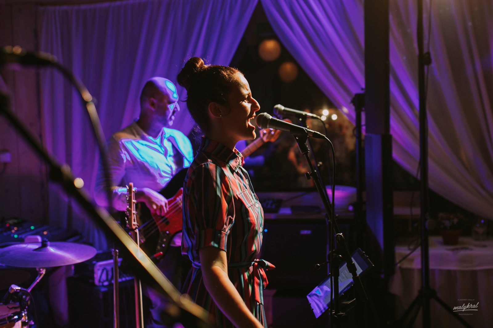 a circular light hanging from the ceiling of a building