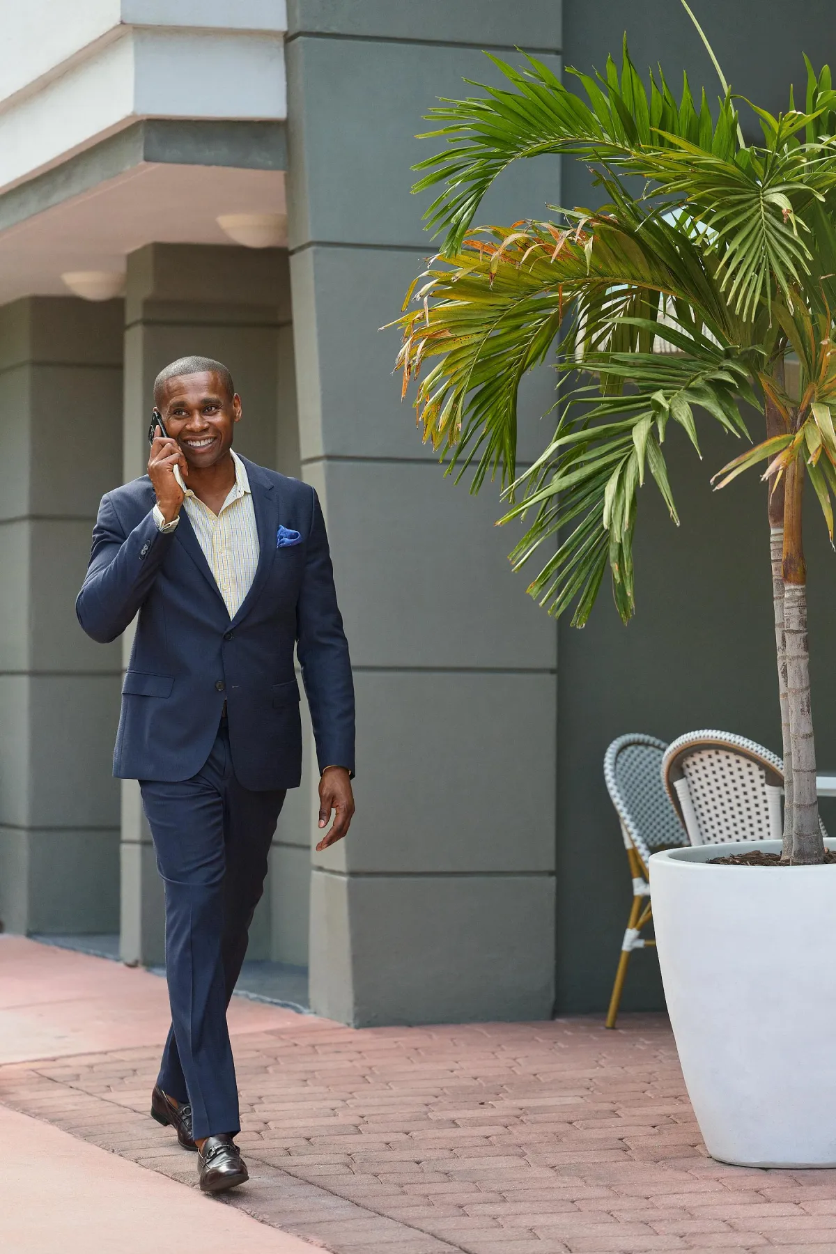man wearing watch with black suit