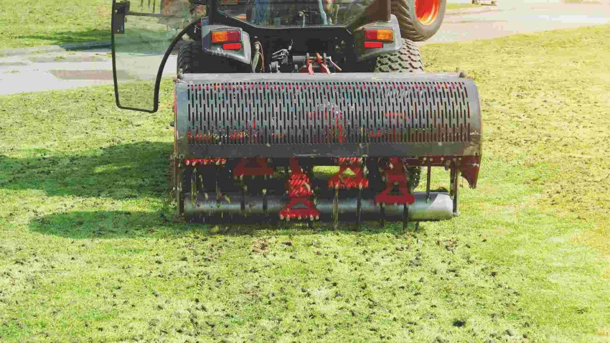 lawn aerator plugging holes into soil 