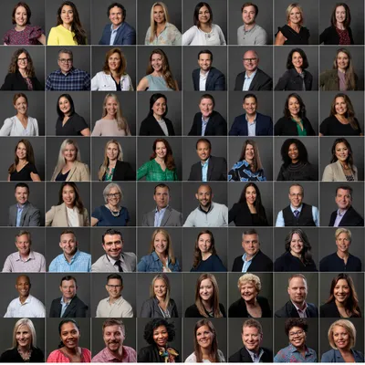 grid containing the headshots of 64 members of the same corporate team