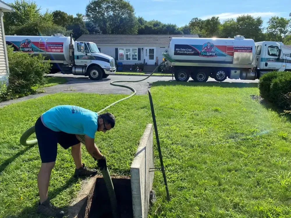 technician using high pressure hydro jetting equipment to clean drains