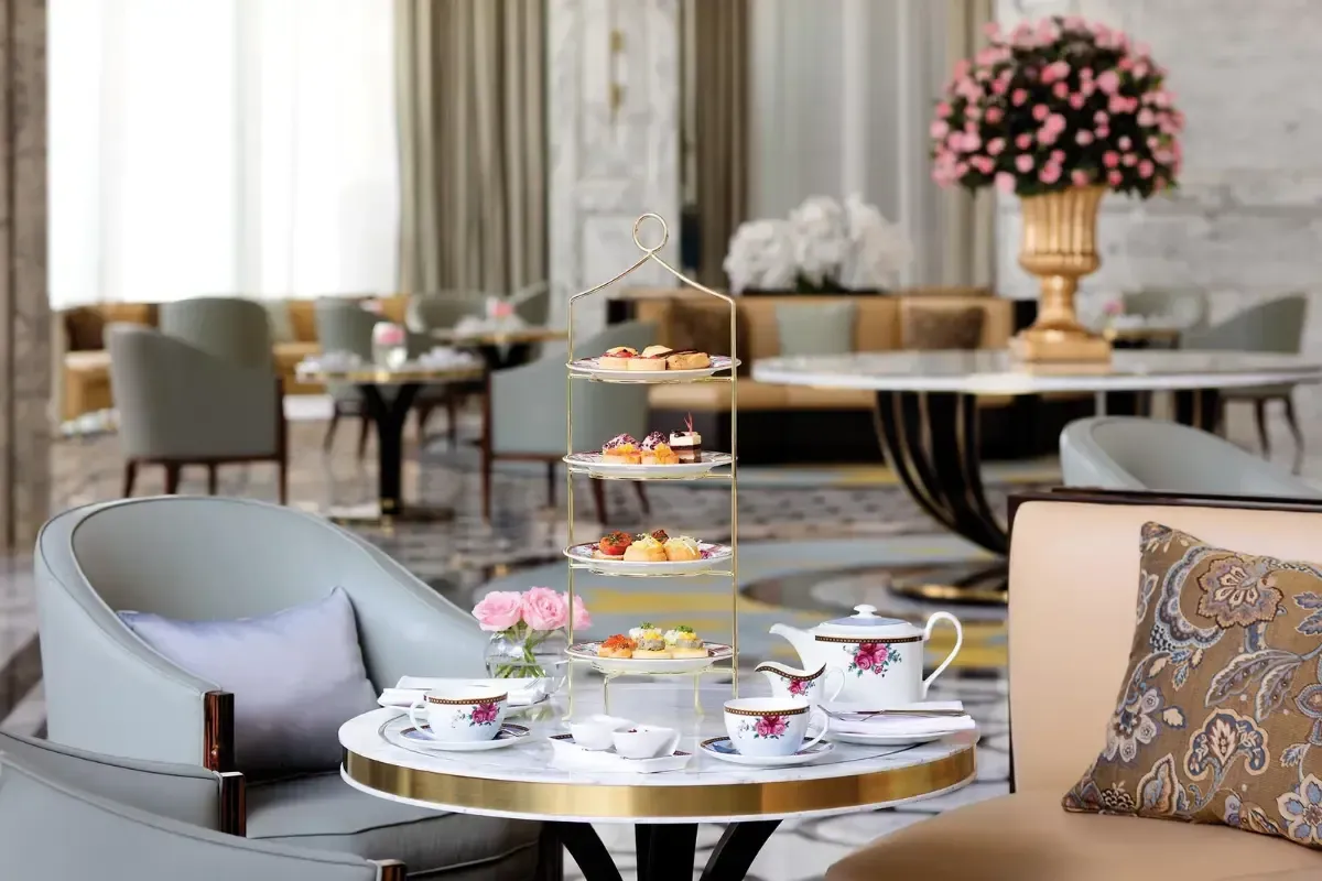 Elegant high tea gathering representing meaningful conversations about land, wealth and legacy.