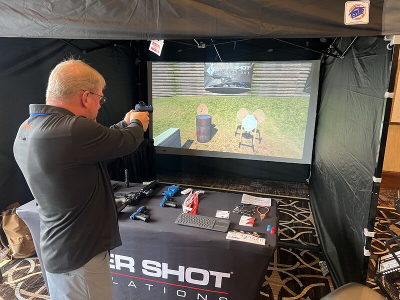 Two marines inspect cots in a room.