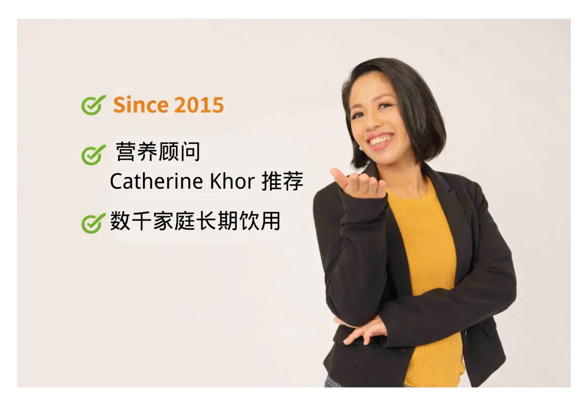 A plastic container filled with blueberries in the grass