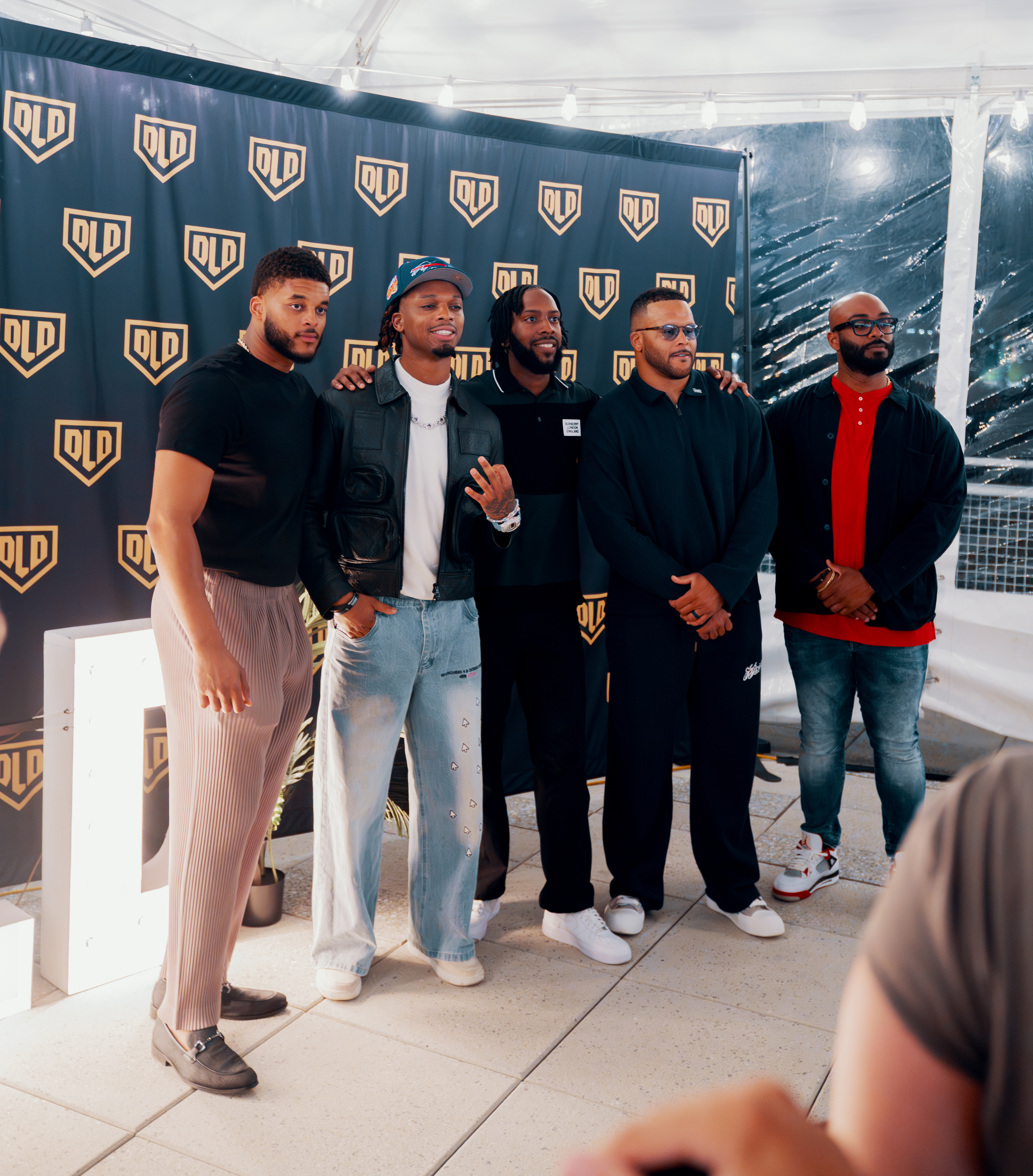 Elliot Donald, Damar Hamlin, and Aaron Donald at a Donald Legacy Defined DLD launch event