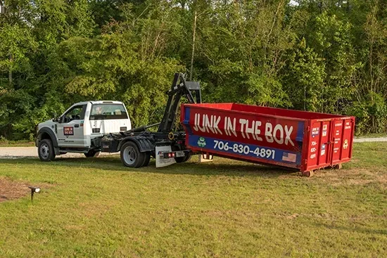 Trash filled cooler on a debris strewn beach