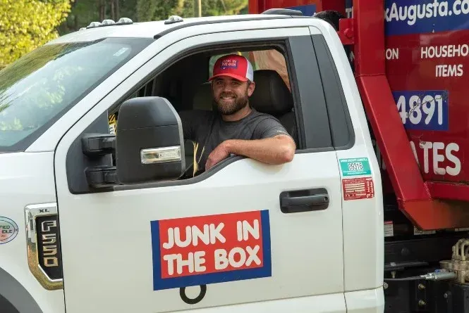 a couple of trash cans sitting next to each other