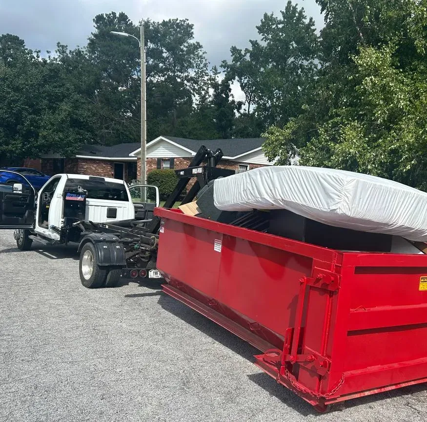 two green and red boxes standing near two motorcycles