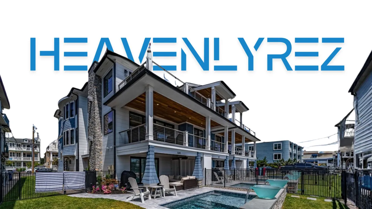 a large white building with a tree in front of it