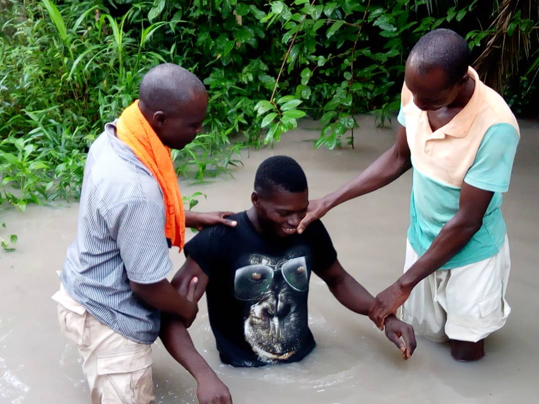 Two Disciples Baptizing a New Believer