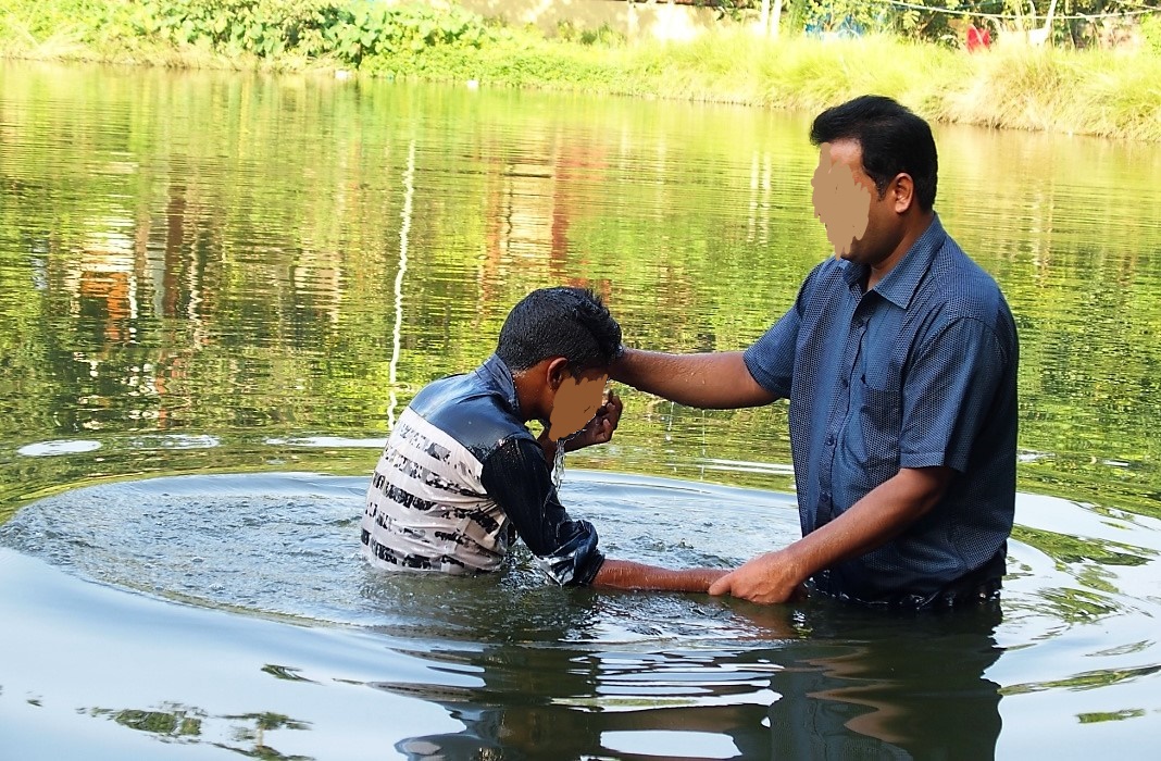Two Disciples Baptizing a New Believer