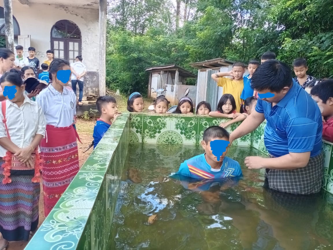 Two Disciples Baptizing a New Believer