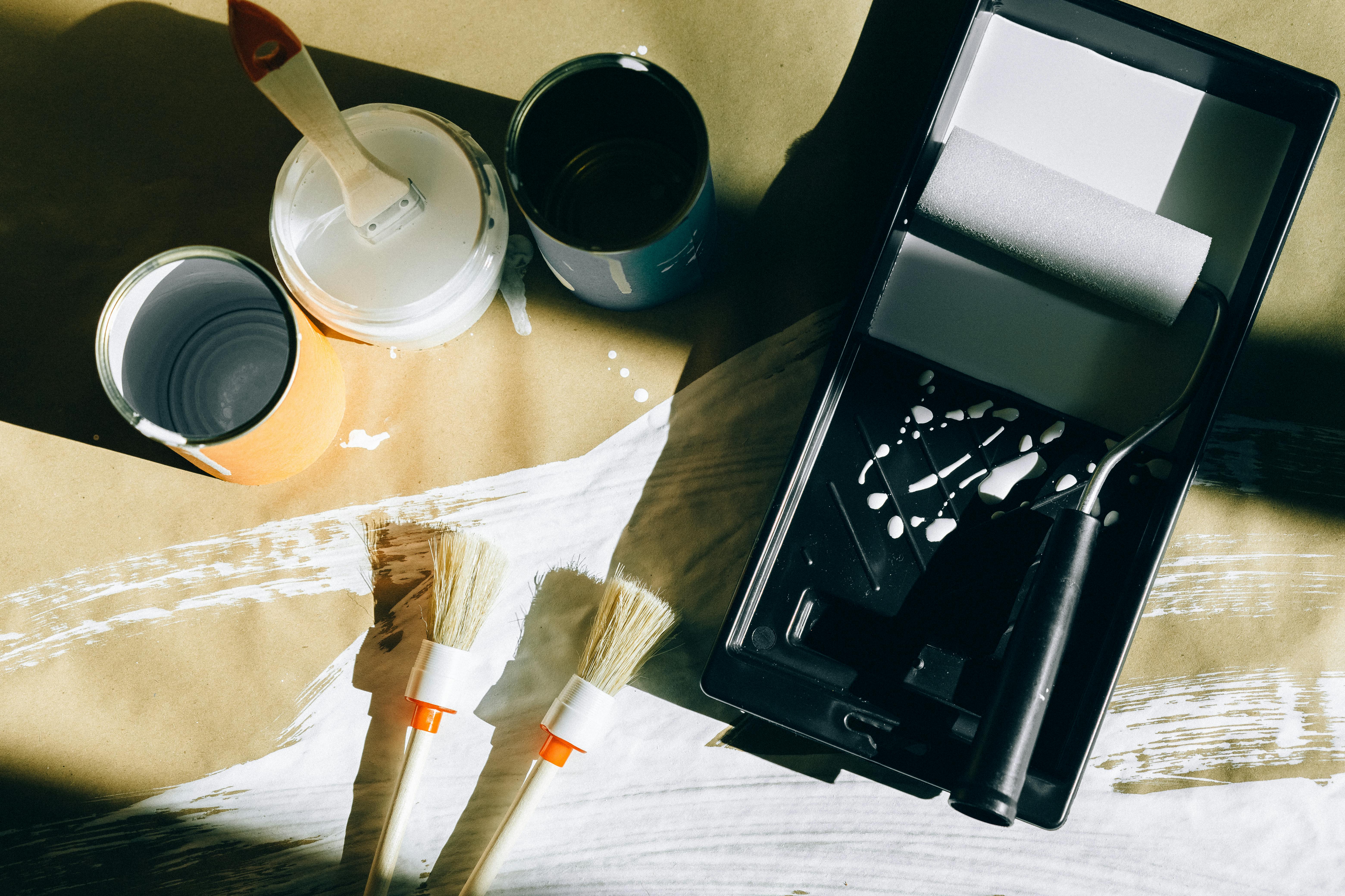 paint brushes and cans