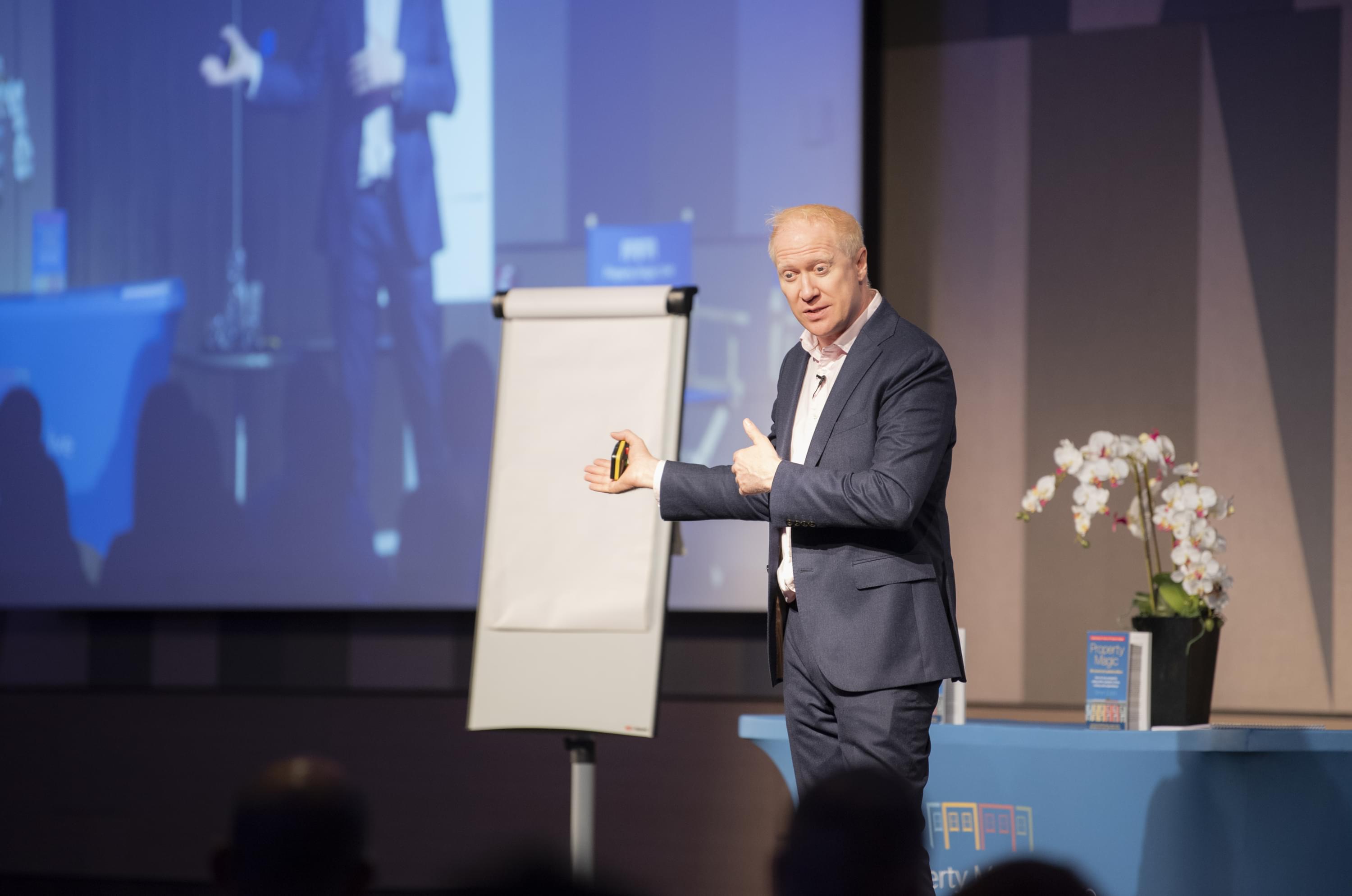 three person standing near wall inside building