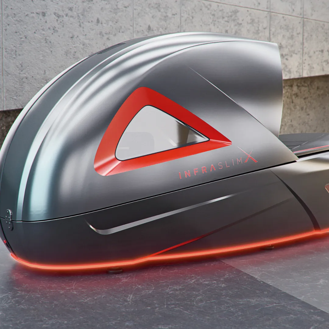 InfraslimX machine with a sleek metallic gray and red design, featuring illuminated edges for a modern and high-tech look. The machine’s design includes angular accents and a sophisticated, futuristic aesthetic.