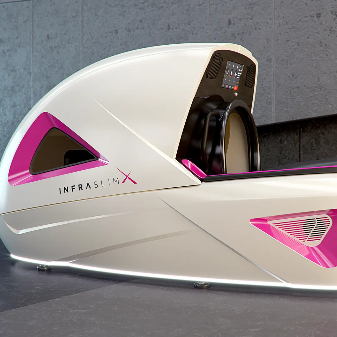 InfraslimX machine with sleek white design and vibrant pink accents, featuring an advanced control panel for an immersive wellness experience.