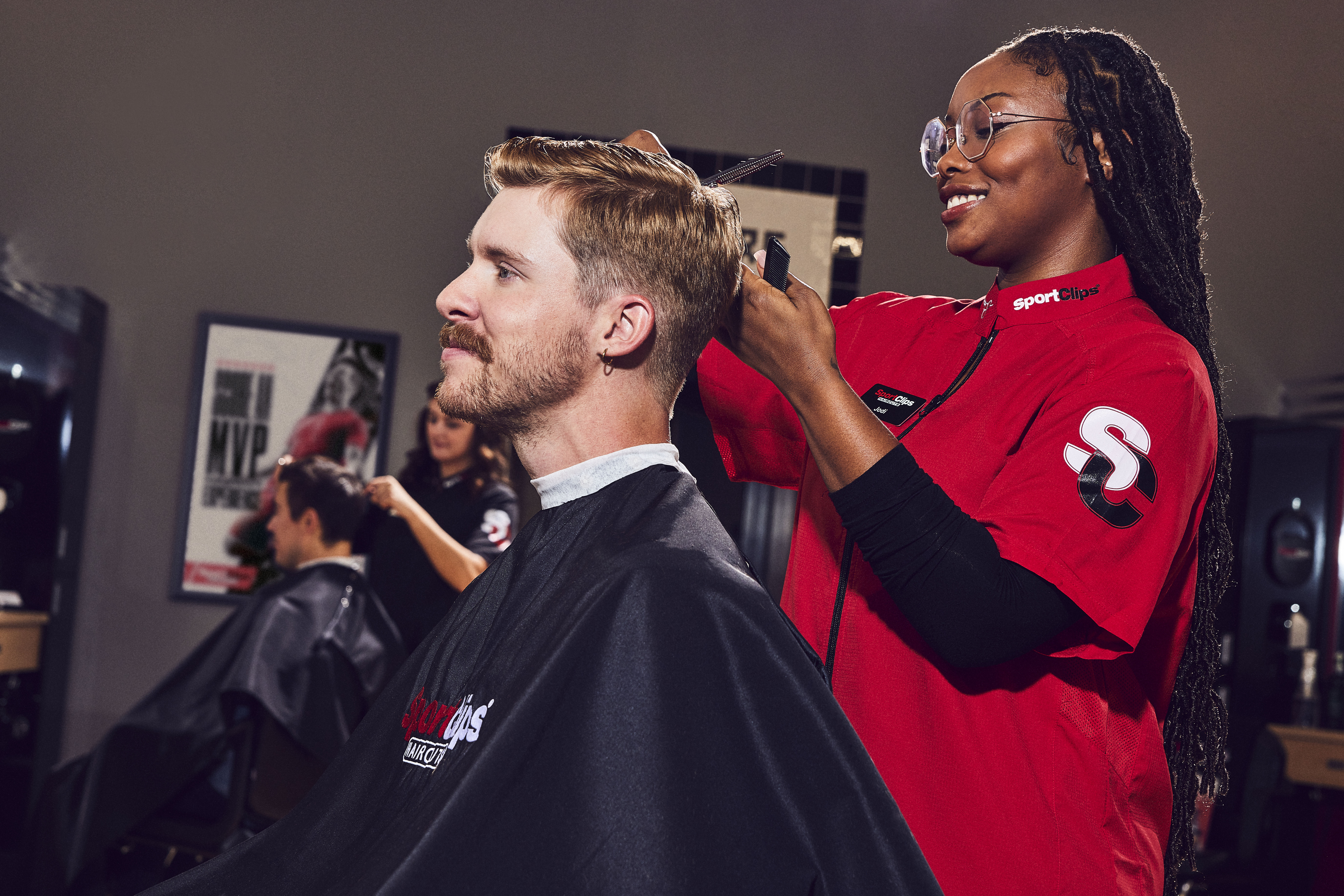 A person using a hair dryer on a cat