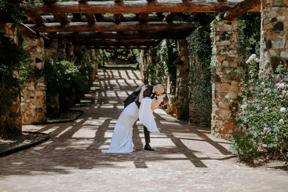A couple of people that are walking down a path