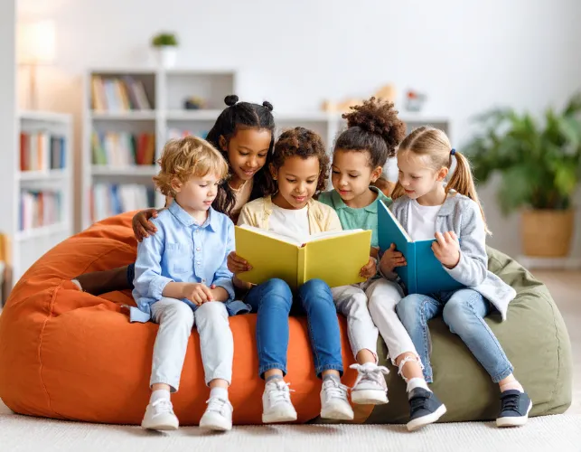 a classroom filled with desks and a chalkboard