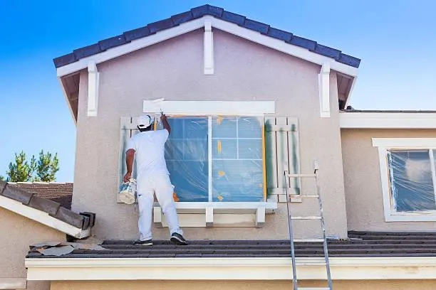 Painting team prepping home exterior in Worcester County