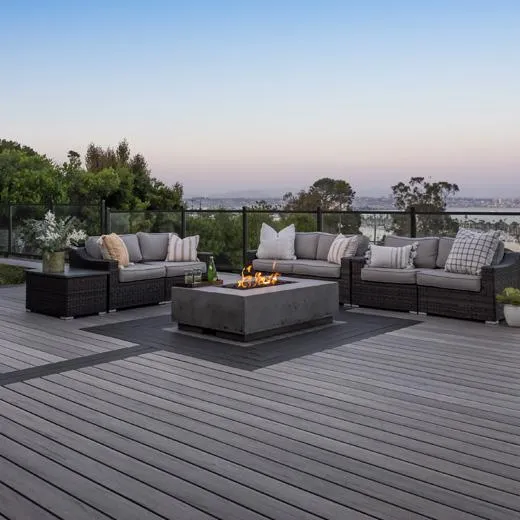 Rooftop deck with fire pit and cozy seating overlooking a scenic cityscape, ideal for urban outdoor living.