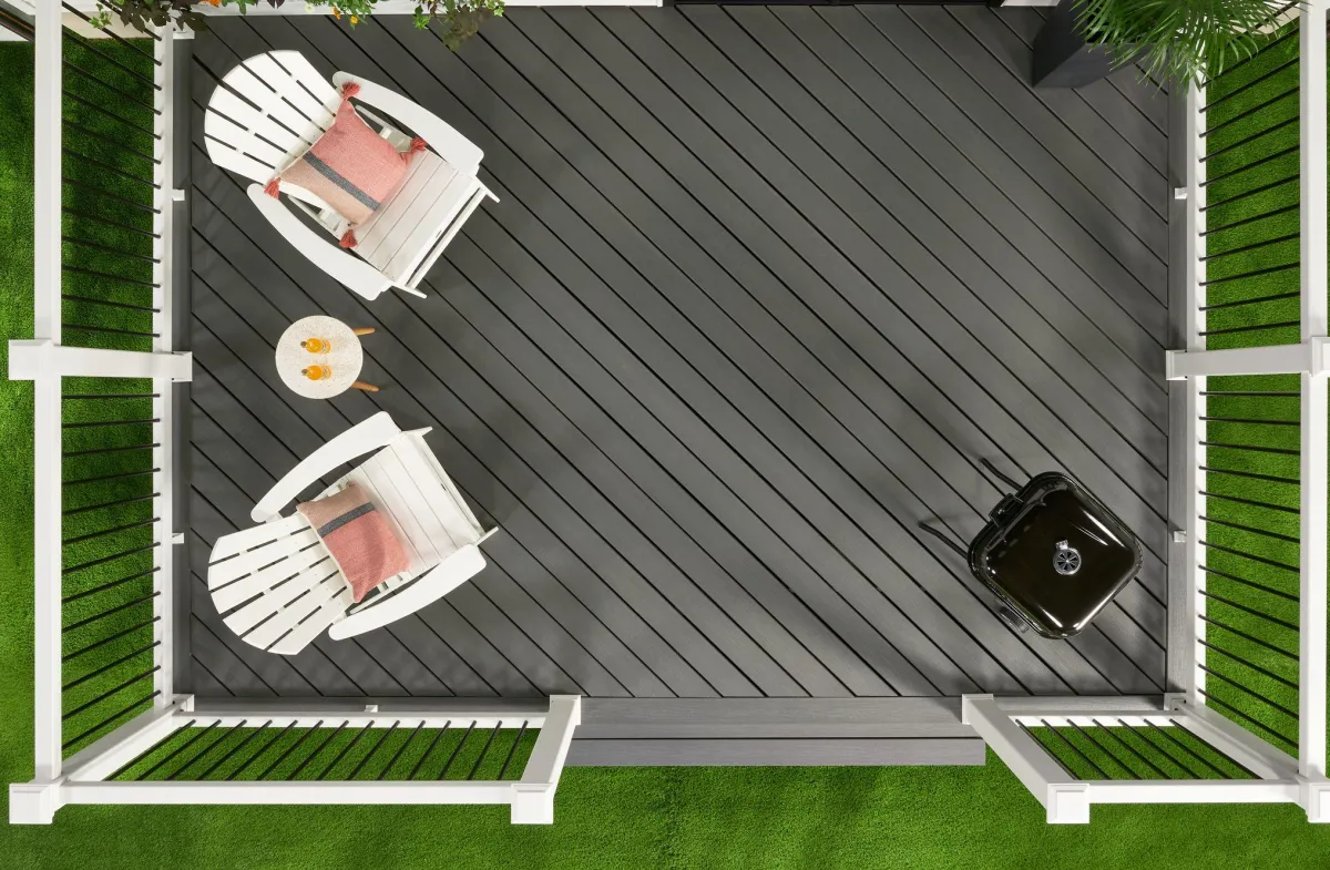 Modern outdoor deck design with comfortable seating and lush greenery.