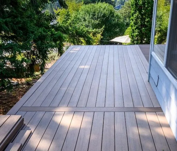 Elevated backyard deck featuring seamless installation by Skyline Decks, perfect for serene outdoor relaxation and entertainment.