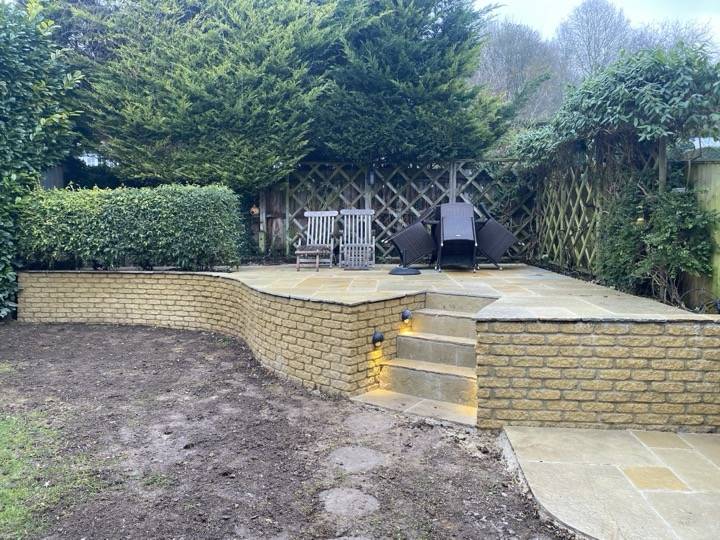 Sandstone patio with retaining wall and steps — patio installation project in Reading
