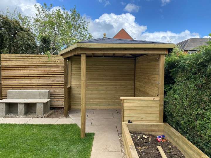 Timber gazebo with raised sleeper planters and slatted fence — garden landscaping in Reading, Berkshire