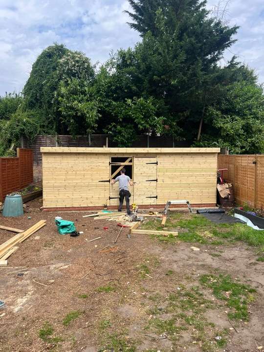 Timber frame construction for garden building — landscaping project in progress in Reading