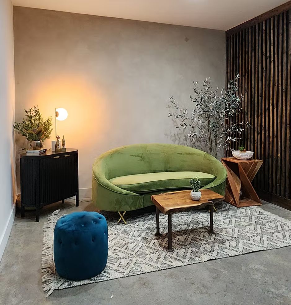 Women filming content in front of pastel studio backdrops and styled props