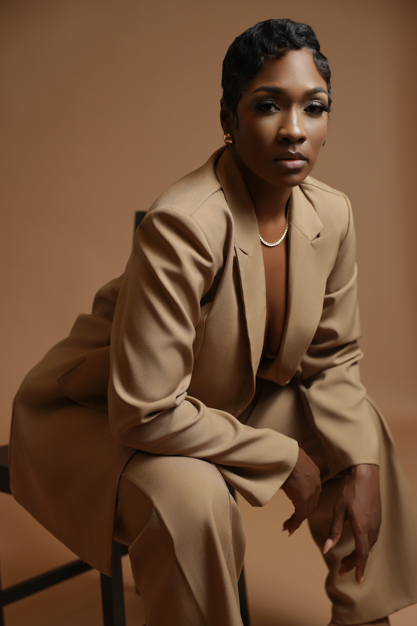 Professional woman in sharp boardroom blazer