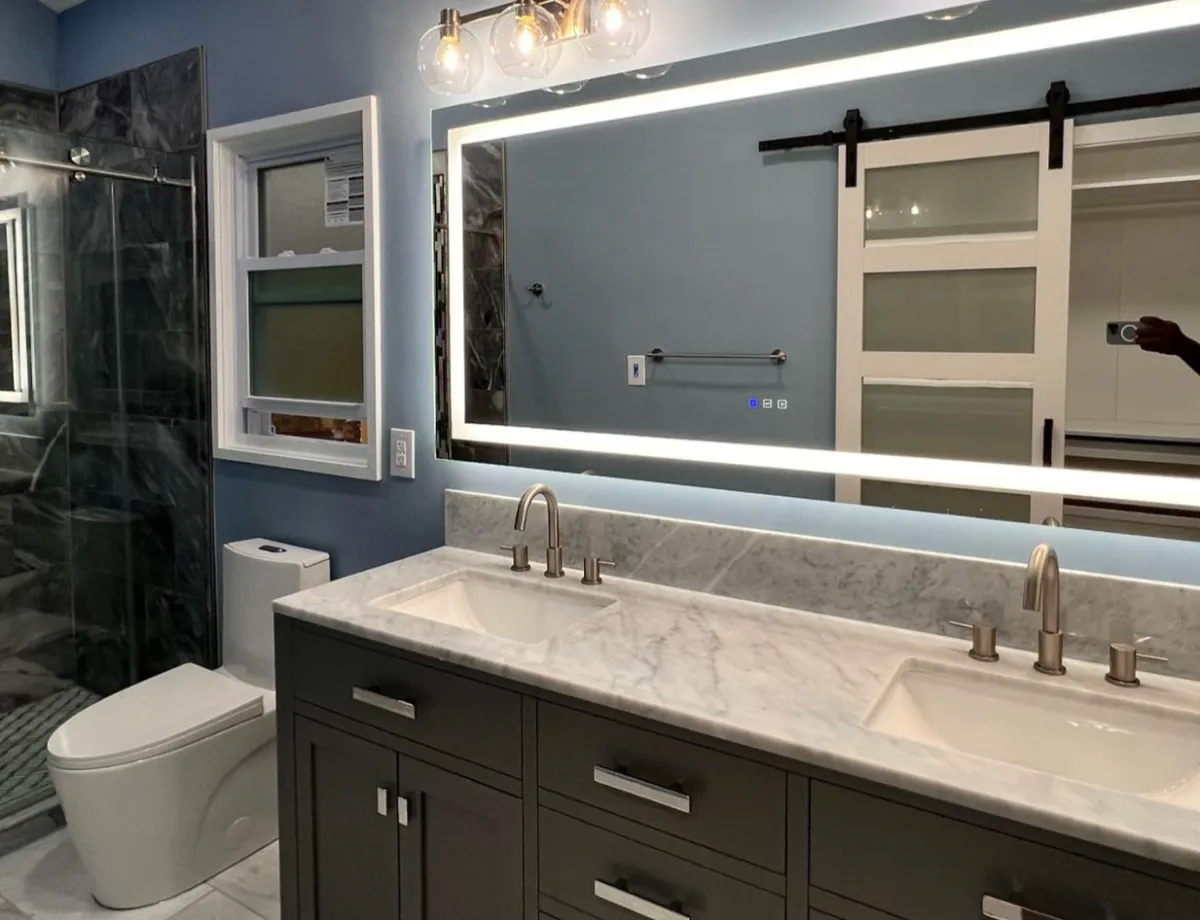 Master bathroom remodel in Charlotte featuring a custom tile shower and glass enclosure