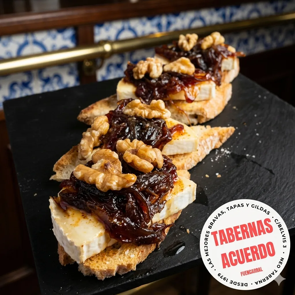 Fachada de Taberna Acuerdo en la calle San Bernardo 98, Chamberí, Madrid, con su característico luminoso verde. Bar restaurante tradicional madrileño, famoso por sus tapas caseras y las Mejores Bravas de Madrid 2025.