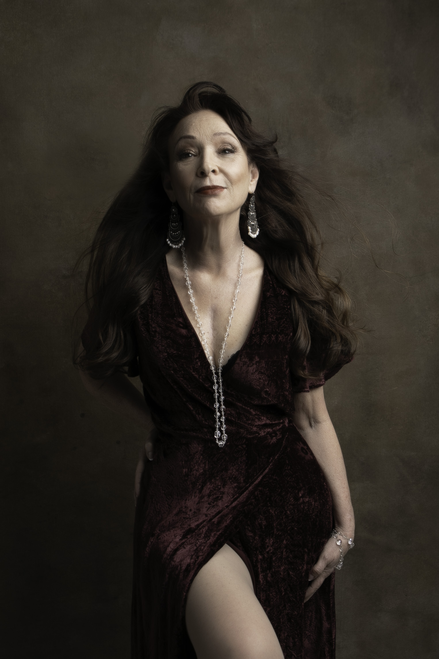 Elegant black and white portrait of a woman in her 60s