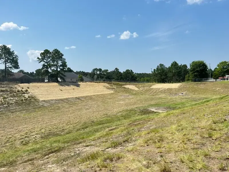 Cleared stormwater pond bank after land clearing SC