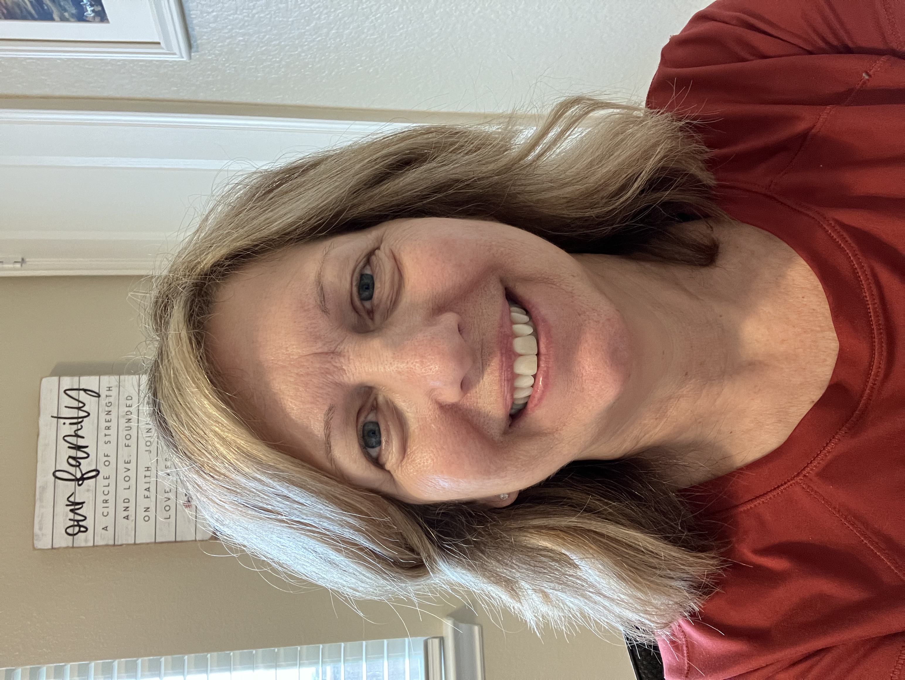 short-haired black cat besides brown wooden table