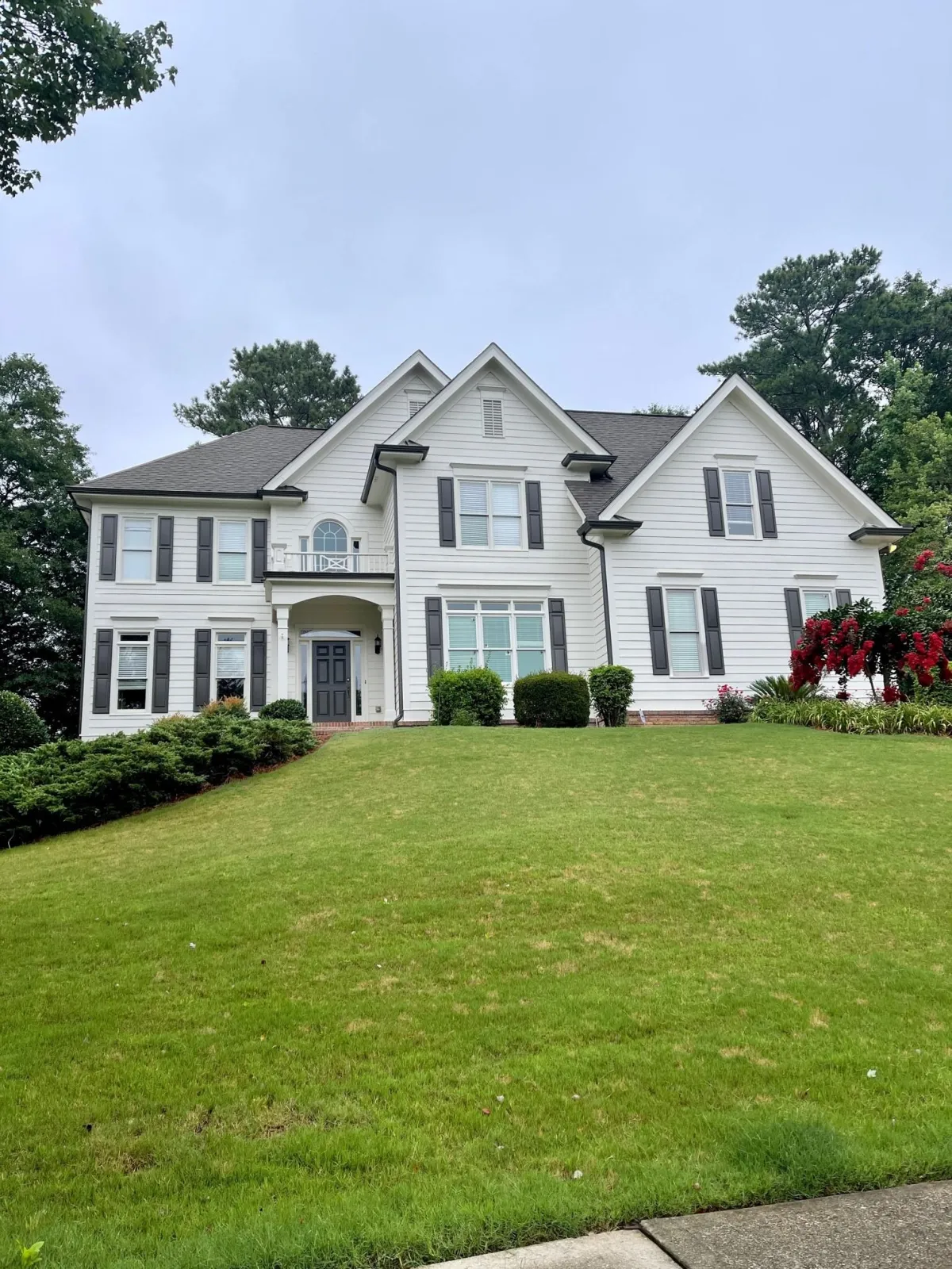 professional exterior painting on large white two-story home in Alpharetta GA